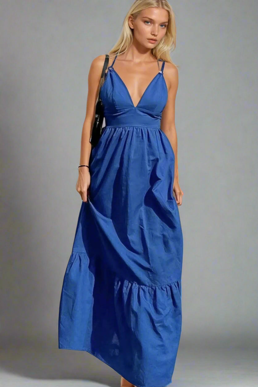 Woman wearing a 100% Cotton Blue Maxi Dress with X Straps on a plain background. Women's dress, maxi dress, cotton dress