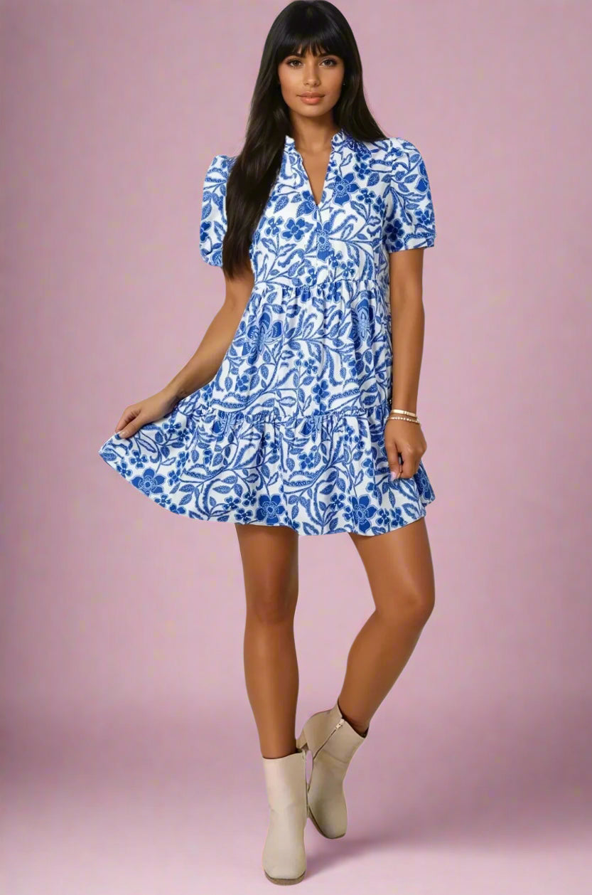 Woman wearing a 100% Cotton Blue Flower Print Mini Dress on a pink background .Women's dress, summer dress, cotton dress, mini dress, cotton mini dress, 100% cotton dress, summer mini dress