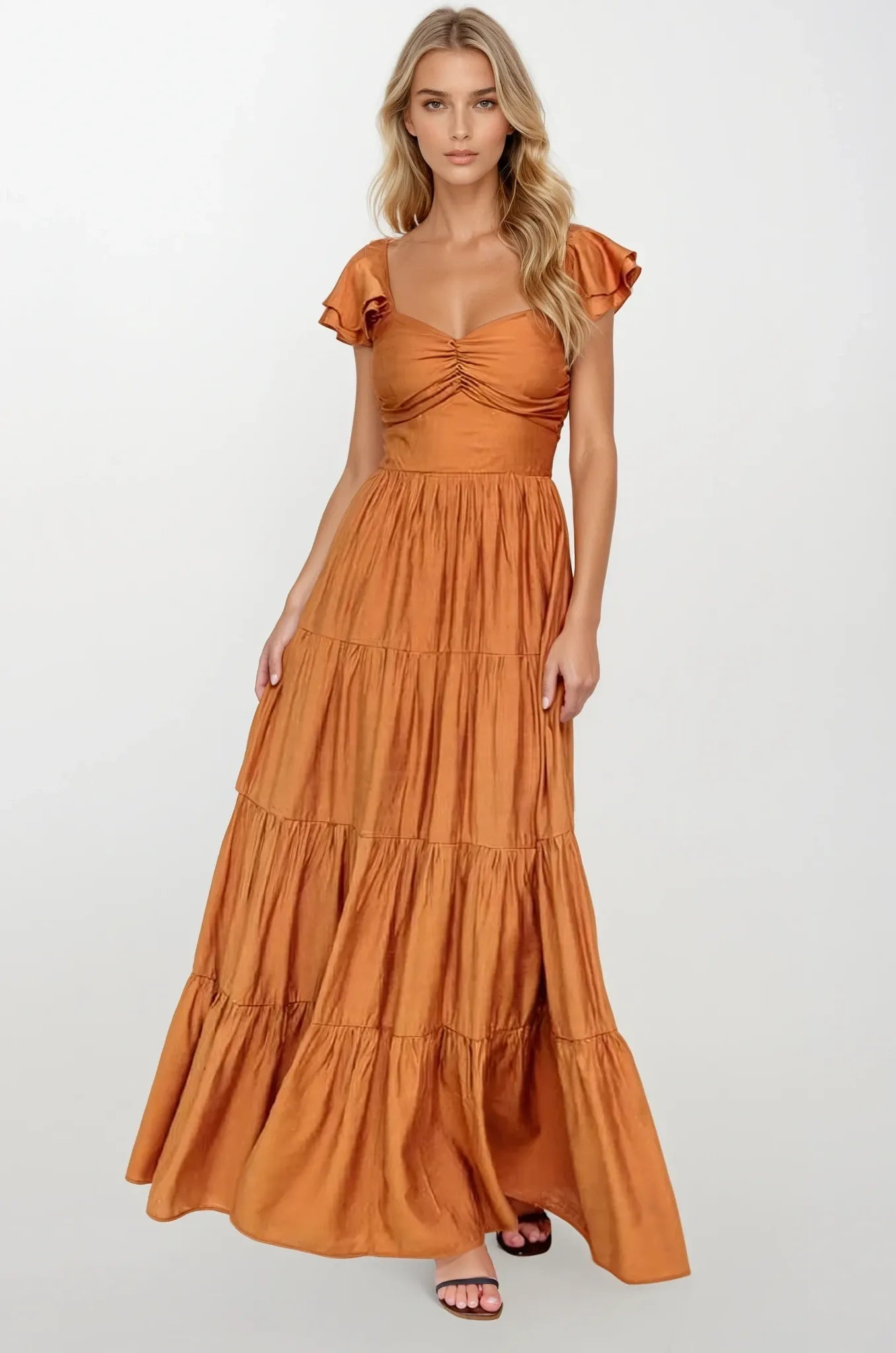 Woman wearing a rust-colored dress with ruffled sleeves on a white background Women's dress, maxi dress, fall dresses