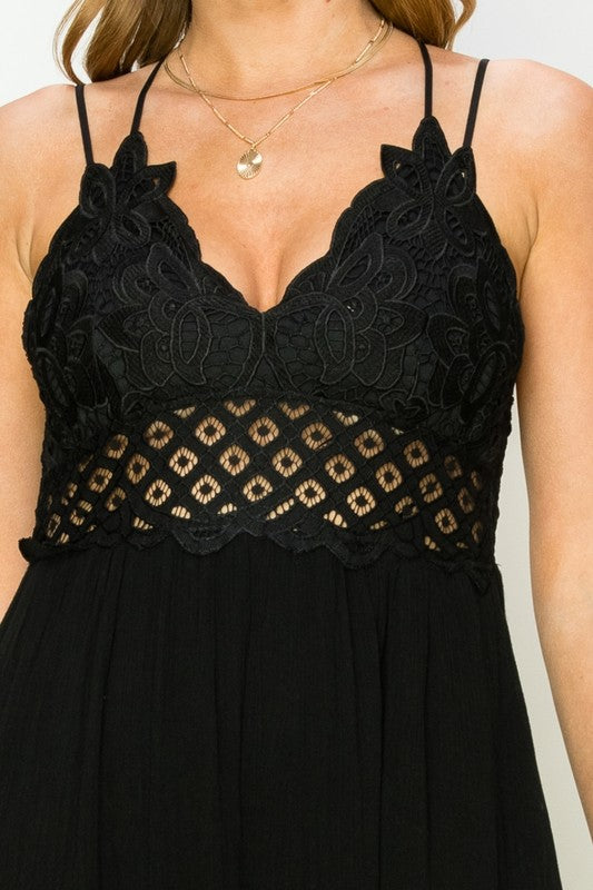 Black lace dress with a plain background. Women's dress, maxi dress
