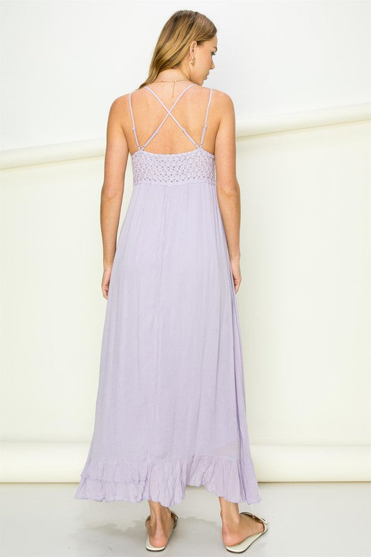 Woman wearing a light purple dress with thin straps against a white background Women's dress, maxi dress