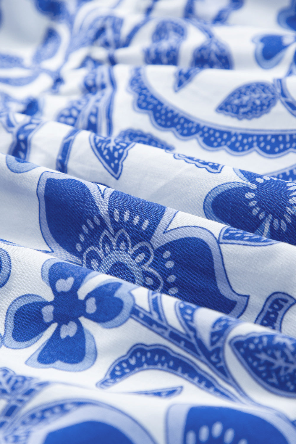 Close-up of blue floral pattern on white fabric. Women's dress, summer dress, cotton dress, mini dress, cotton mini dress, 100% cotton dress, summer mini dress