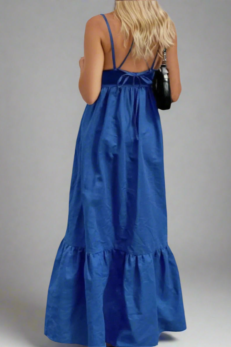 Woman wearing a 100% Cotton Blue Maxi Dress with X Straps on a plain background. Women's dress, maxi dress, cotton dress