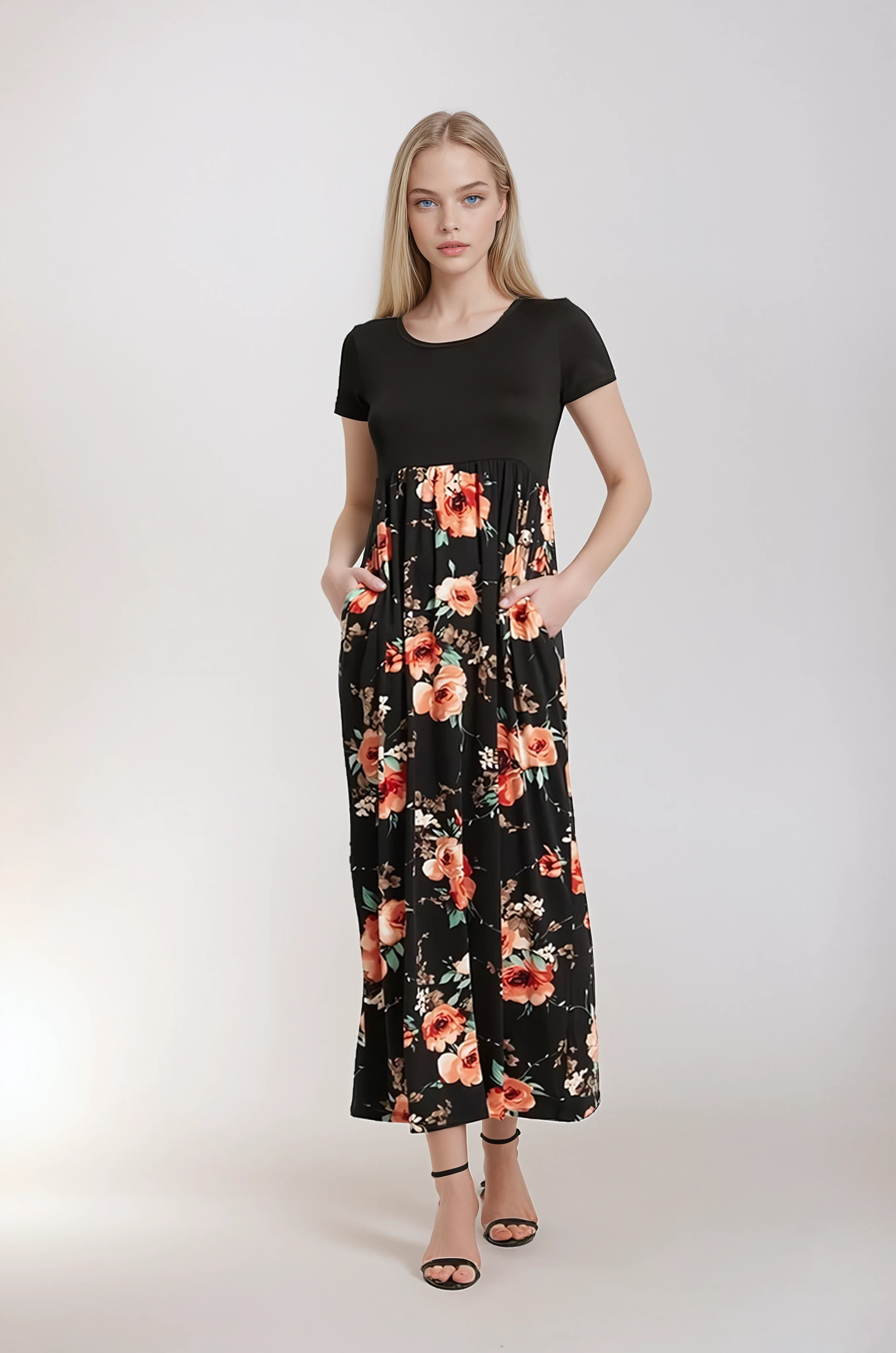 Woman wearing a black dress with floral pattern on a white background. Women's dresses, women's dress, fall dress, floral dress