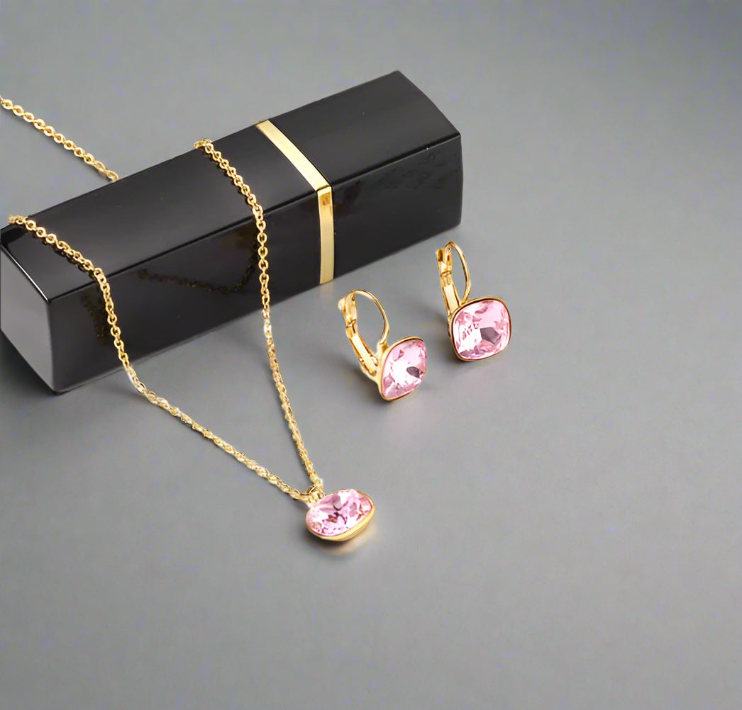 Jewelry set with necklace and earrings on a white surface