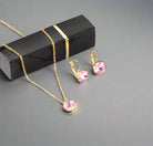 Jewelry set with necklace and earrings on a white surface